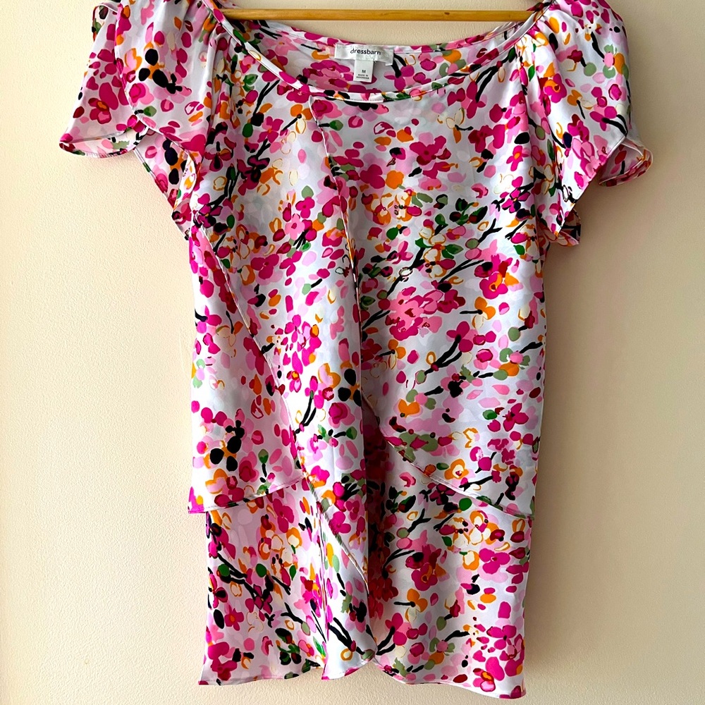 Im selling this blouse that has the colors pink,baby pink,orange,green and black